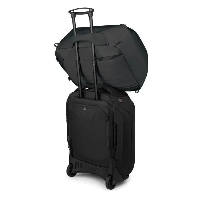 Osprey Sojourn Porter 46L (2026) - travel pack resting on wheeled luggage; luggage is not included, shown in Black