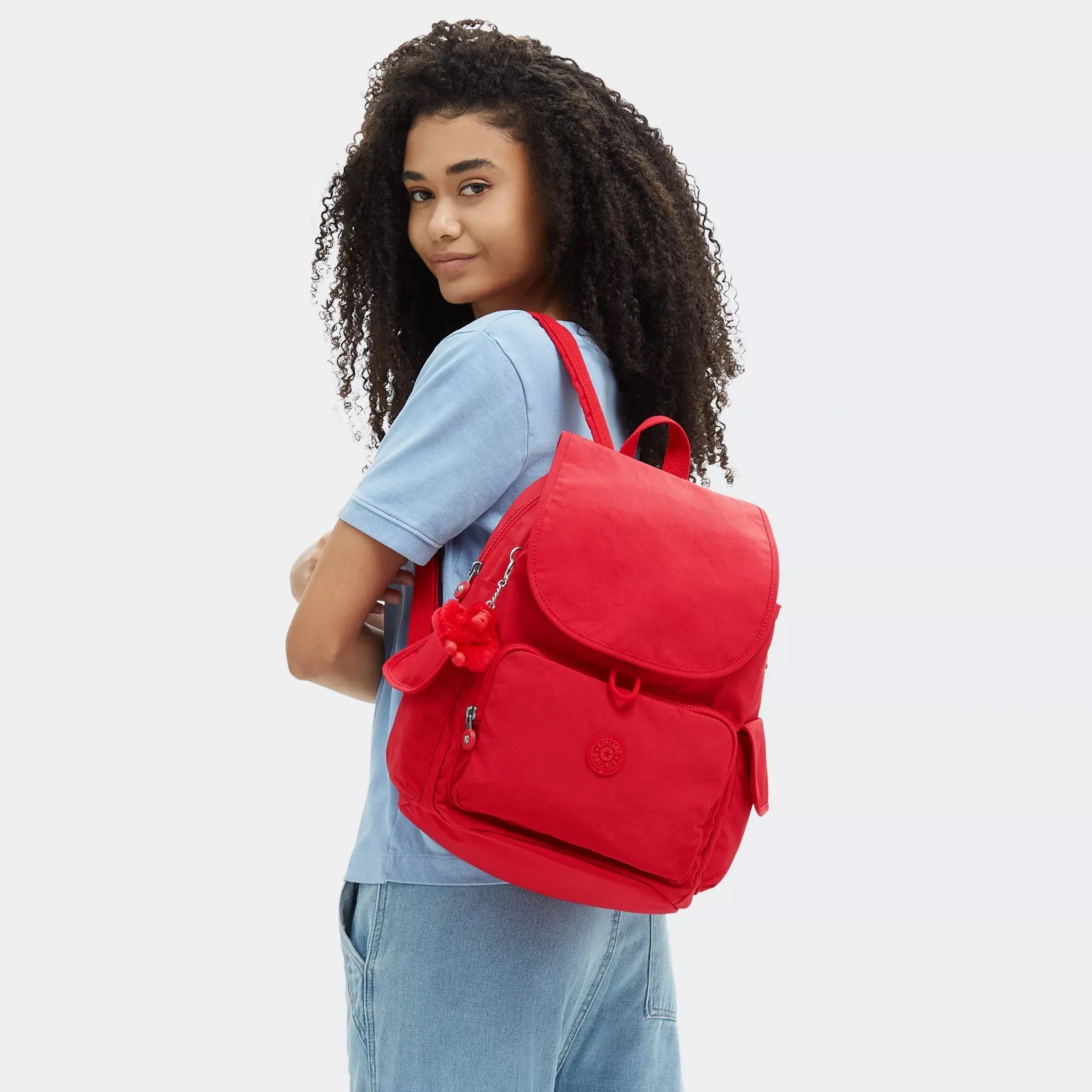 Kipling City Pack Backpack in Red Rouge, worn by a model