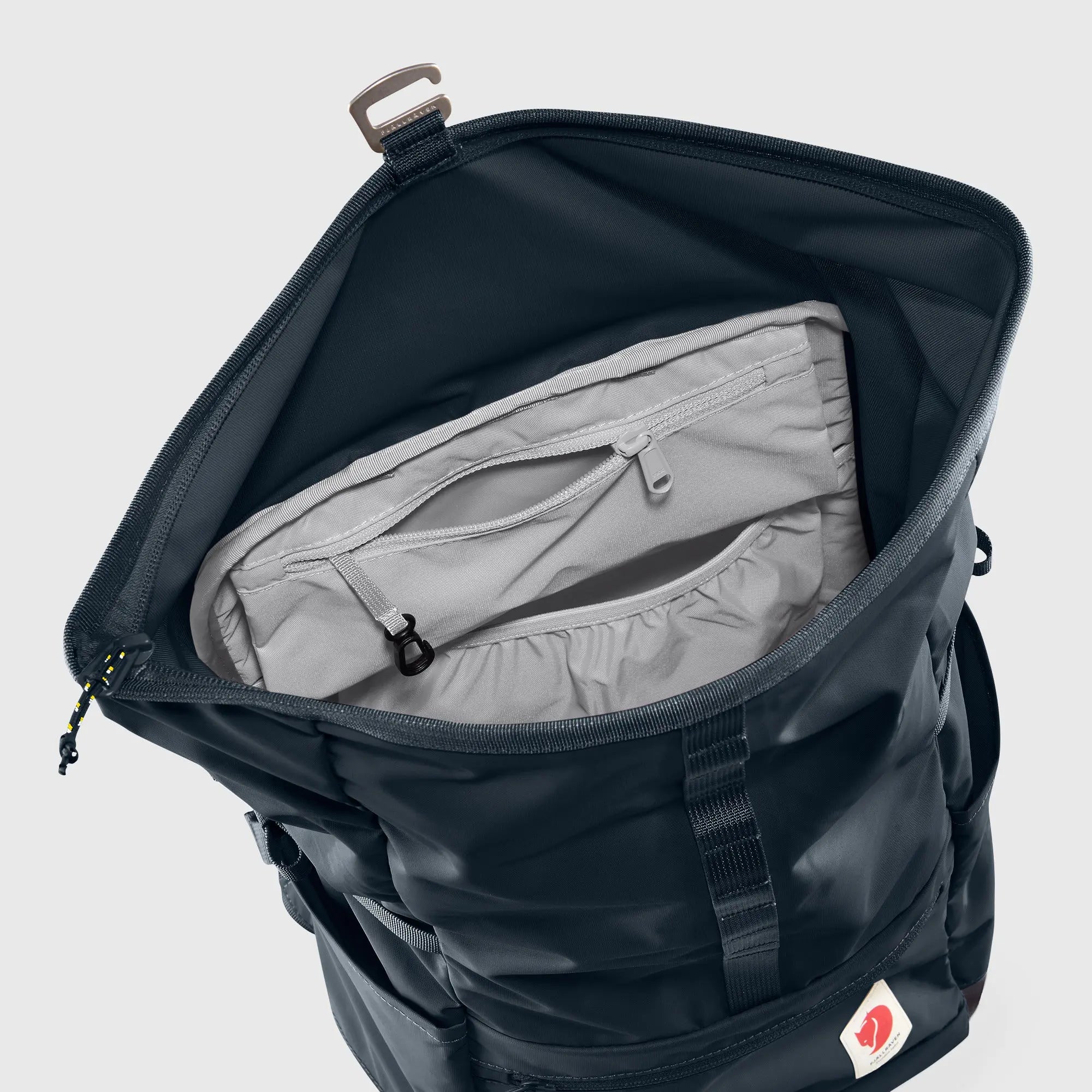 Fjallraven High Coast Foldsack 24, open main compartment and interior pocket, shown in Navy; shared feature image
