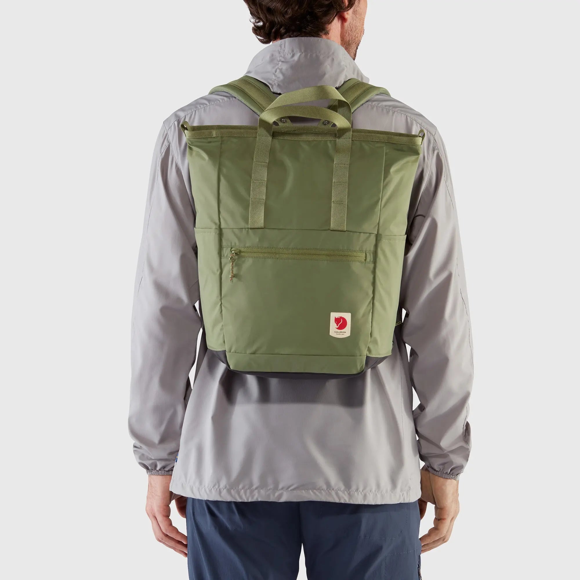 Fjallraven High Coast Totepack, rear backpack fit on a model, shown in Green; shared feature image
