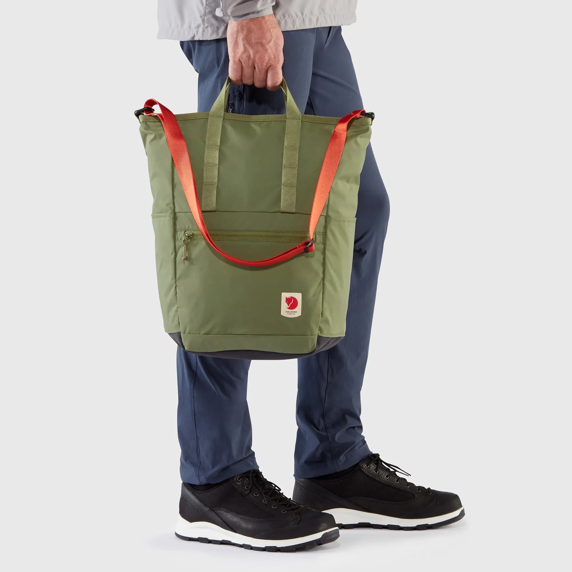 Fjallraven High Coast Totepack, hand carry on a model, shown in Green; shared feature image
