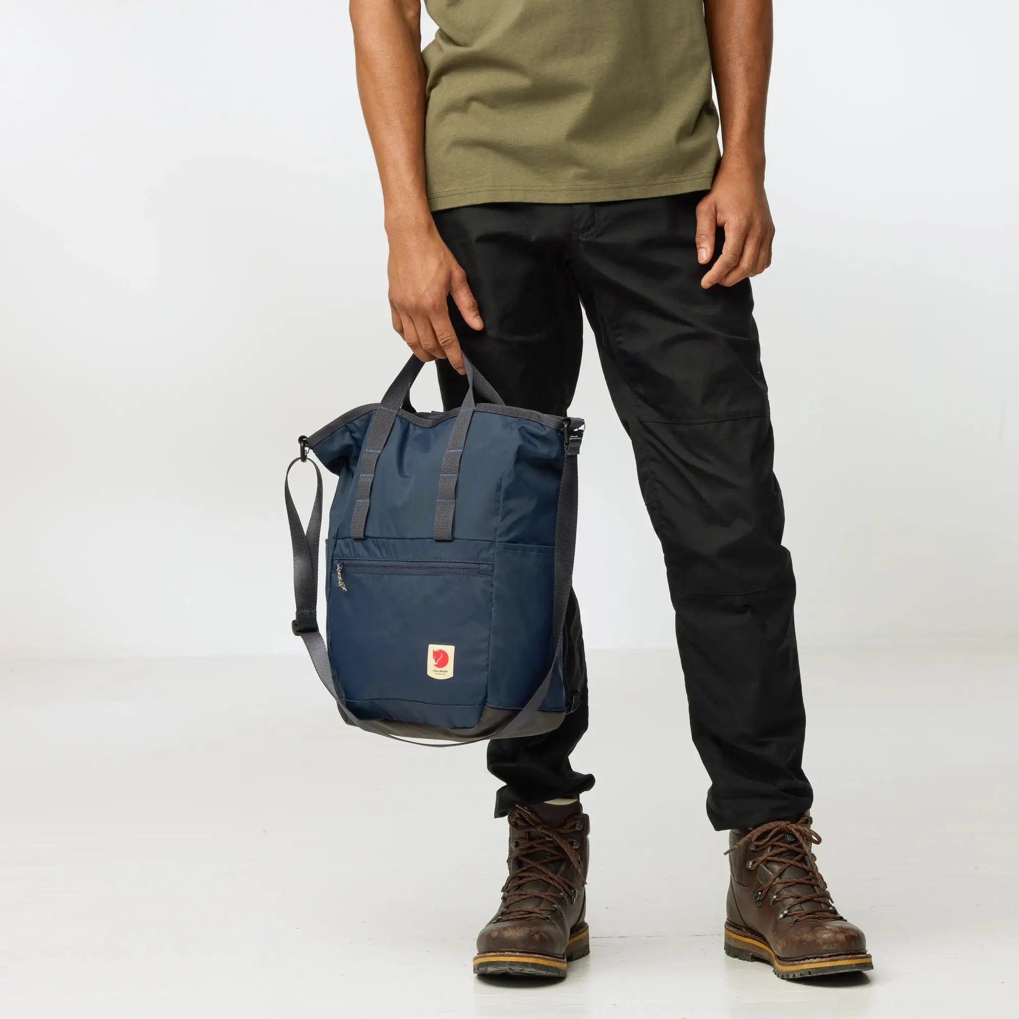 Fjallraven High Coast Totepack, hand carry on a model, shown in Navy; shared feature image