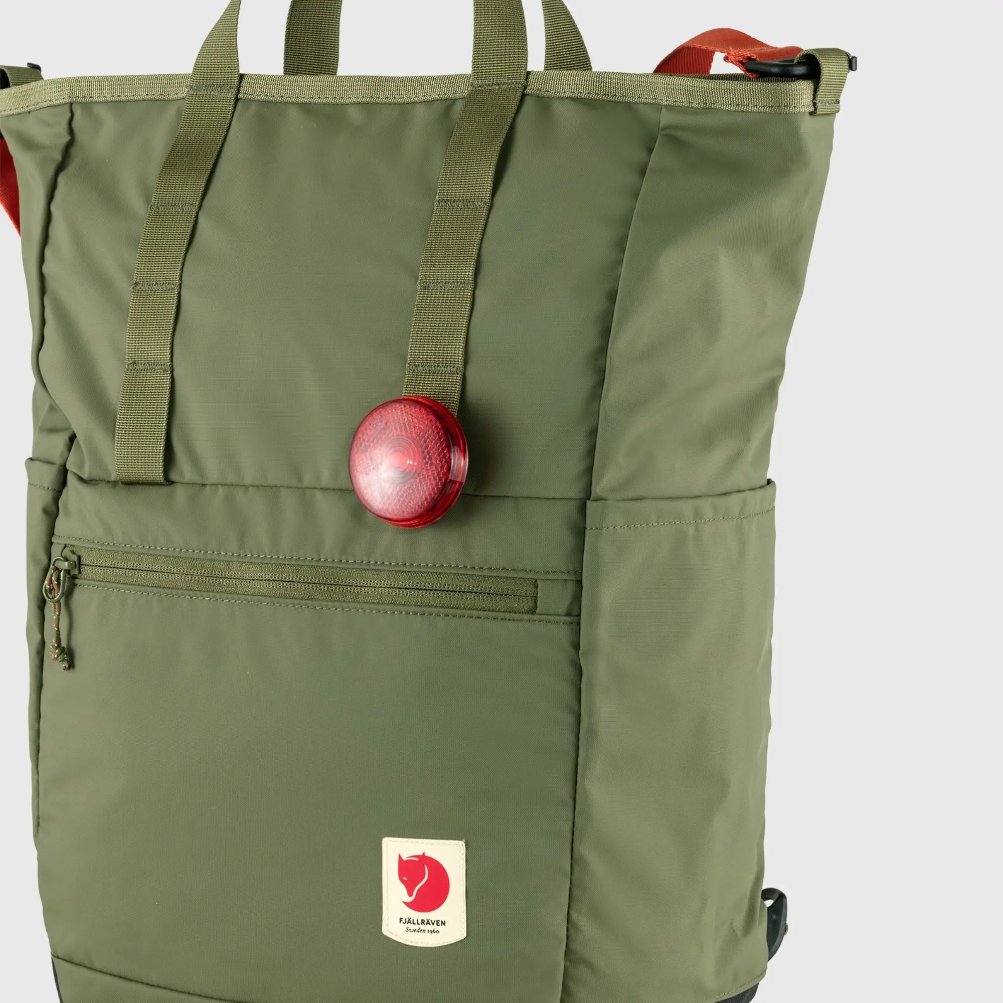 Fjallraven High Coast Totepack, front pocket holding an apple, shown in Green; shared feature image