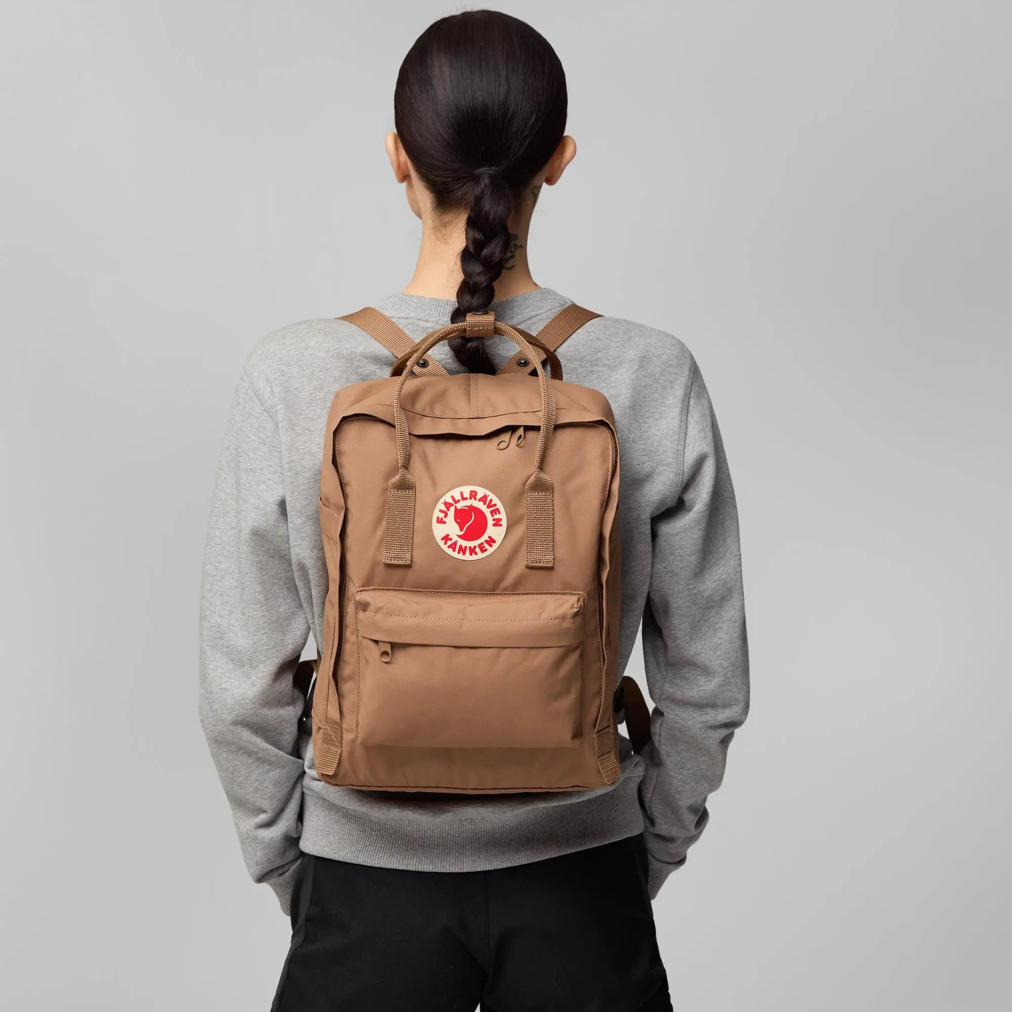 Fjallraven Kanken Backpack, rear backpack fit on a model, shown in Khaki Dust; shared feature image