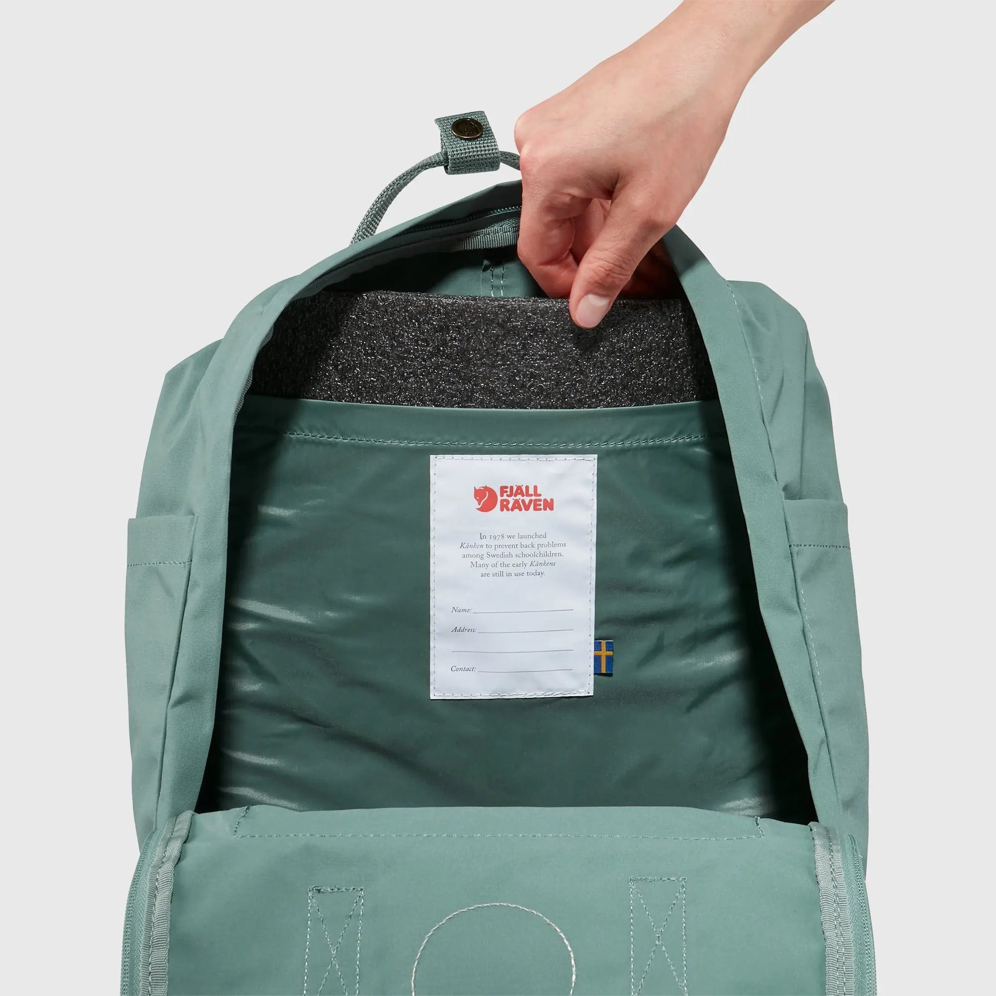 Fjallraven Kanken Backpack, removable seat pad and interior name label, shown in Frost Green; shared feature image