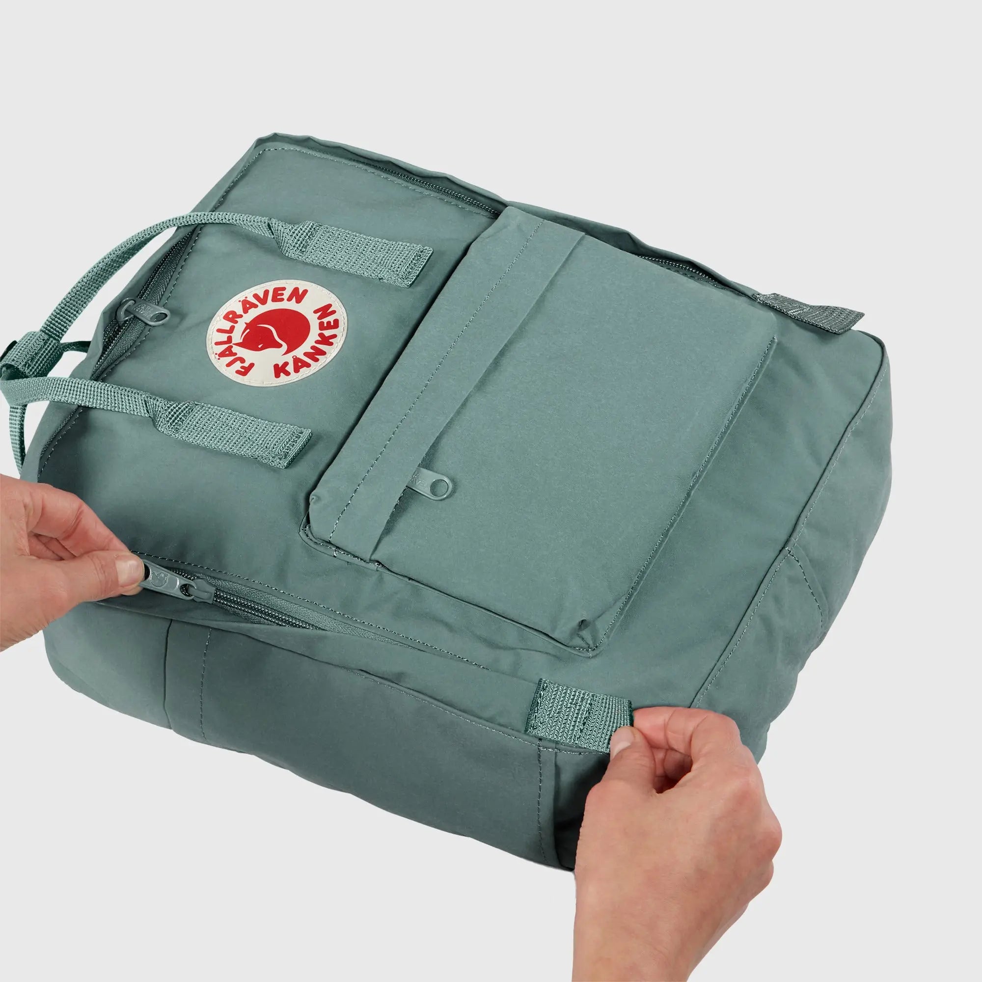 Fjallraven Kanken Backpack, wide-opening main compartment demonstration, shown in Frost Green; shared feature image