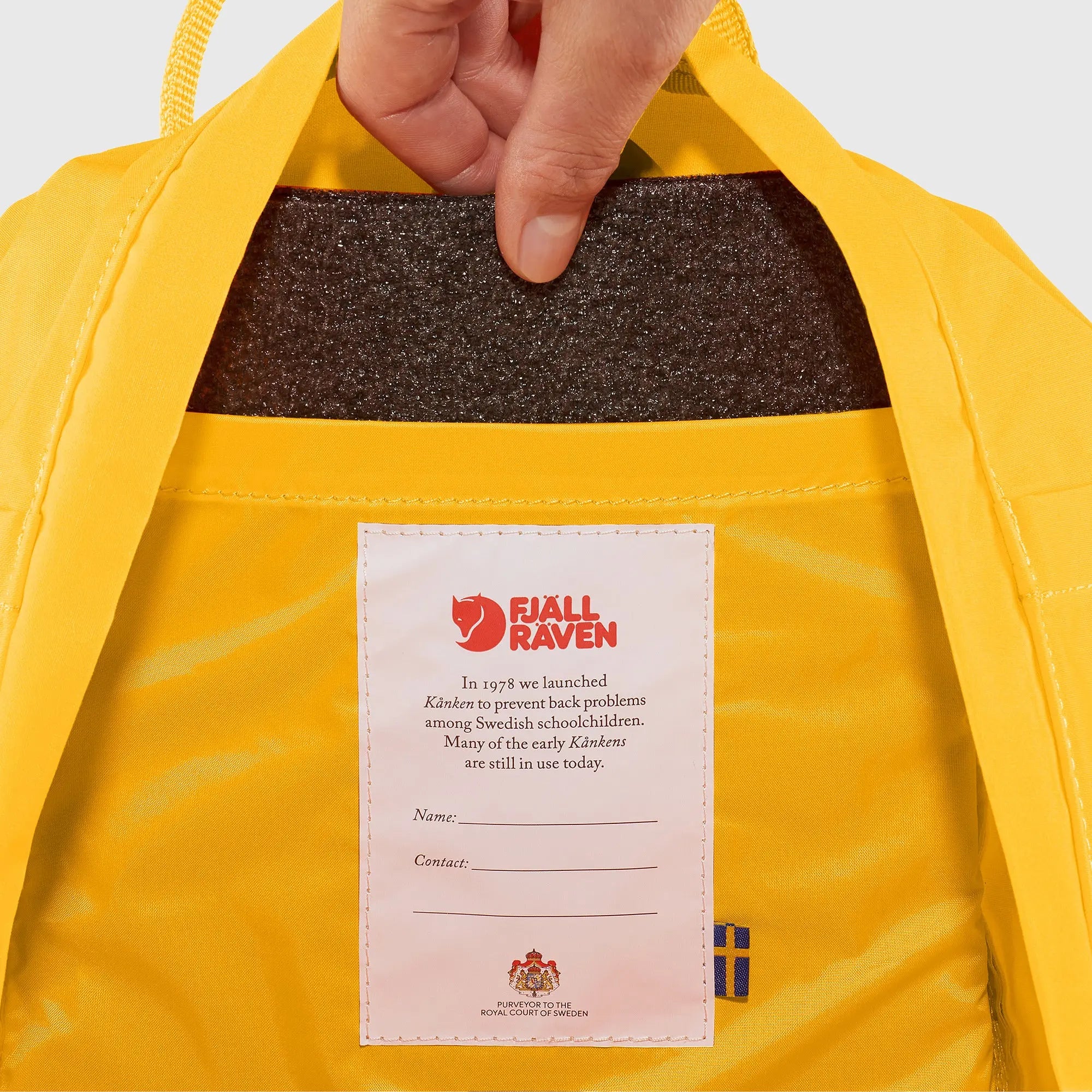 Fjallraven Kanken Mini Backpack, removable seat pad and interior name label, shown in Warm Yellow; shared feature image