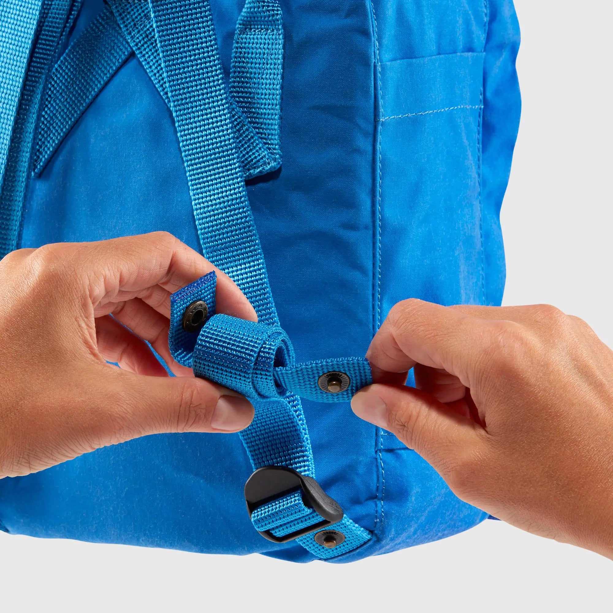 Fjallraven Kanken Mini Backpack, shoulder-strap adjustment demonstration, shown in blue; shared feature image