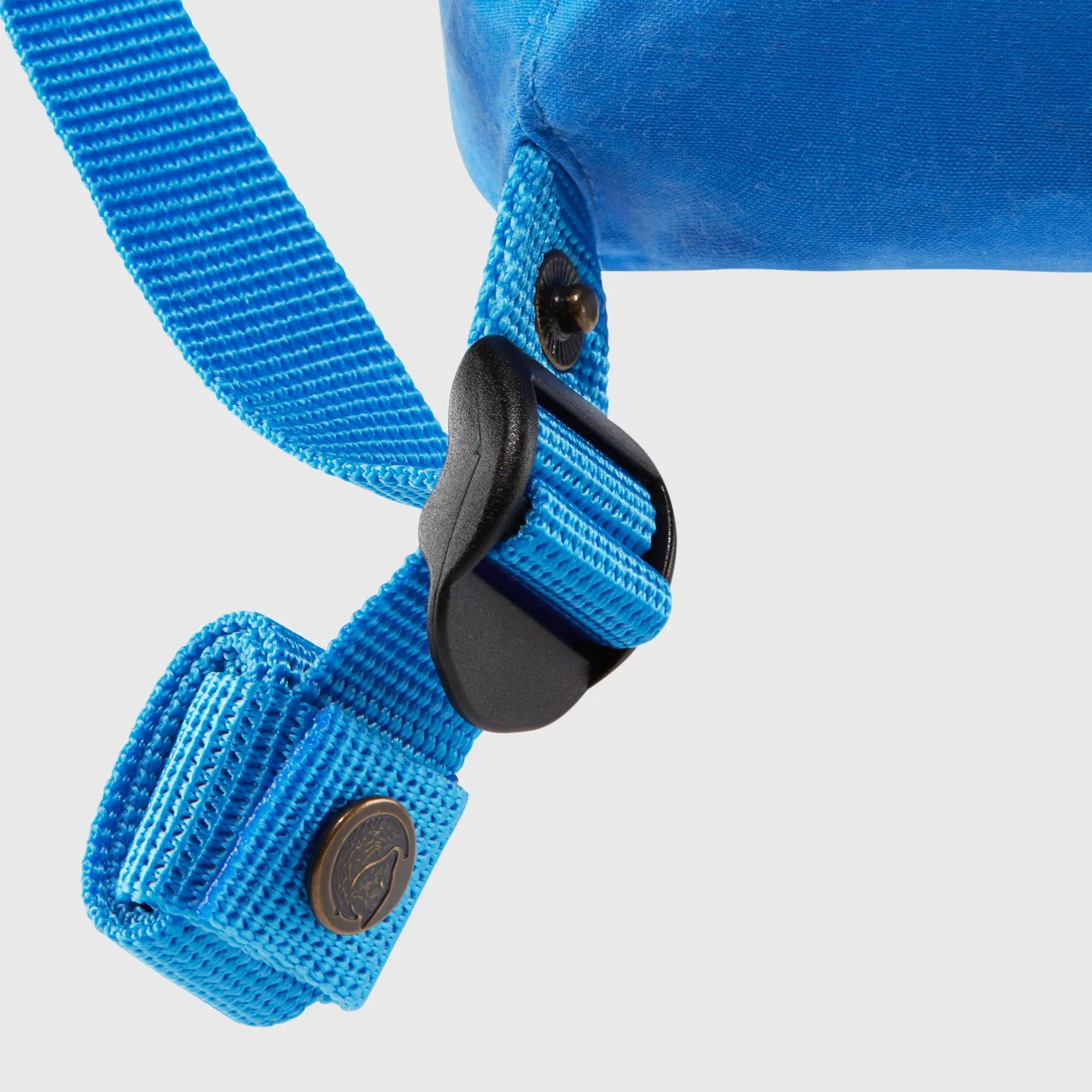 Fjallraven Kanken Mini Backpack, strap buckle and snap detail, shown in blue; shared feature image