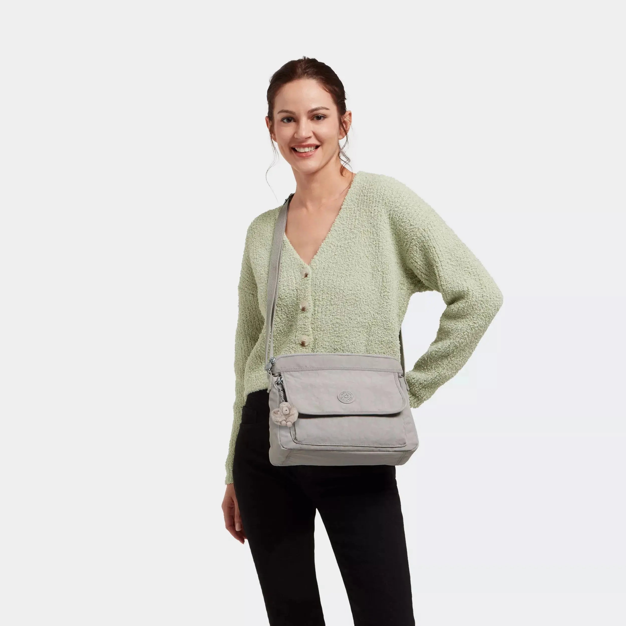 Kipling Aisling Crossbody Bag in Grey Gris, worn by a model