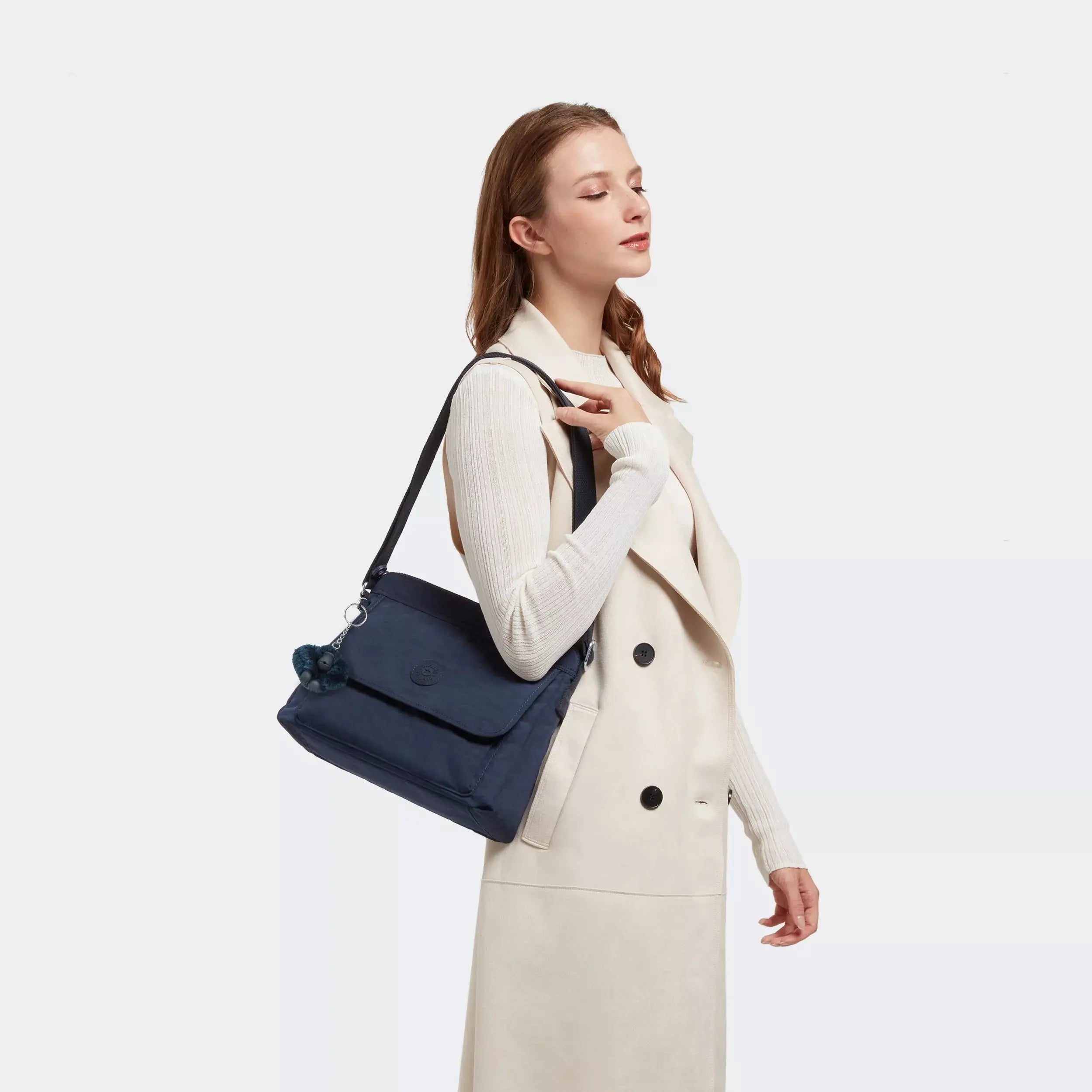 Kipling Aisling Crossbody Bag in Blue Bleu 2, worn by a model