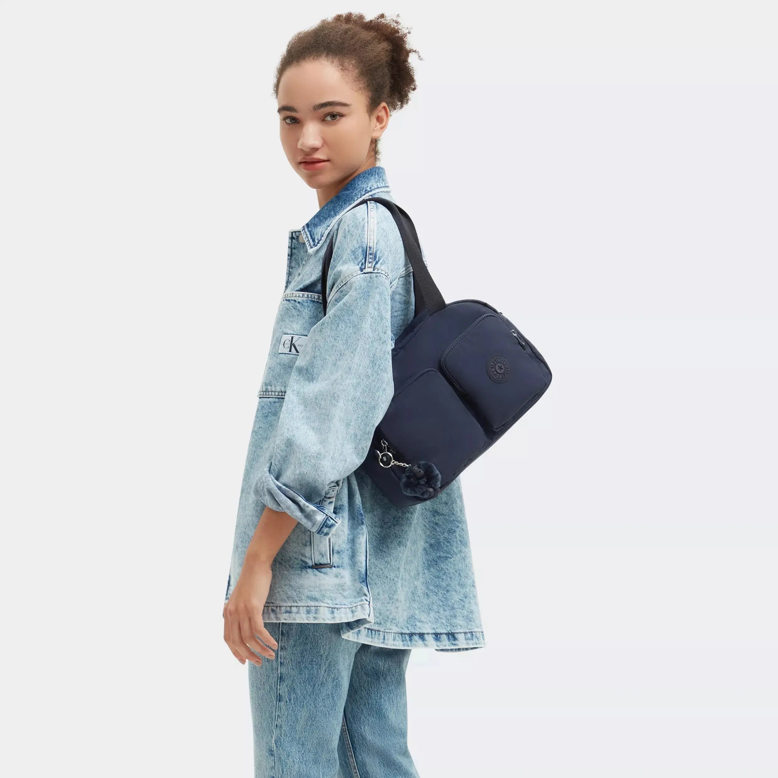 Kipling Cool Defea Shoulder Bag in Blue Bleu 2, worn by a model
