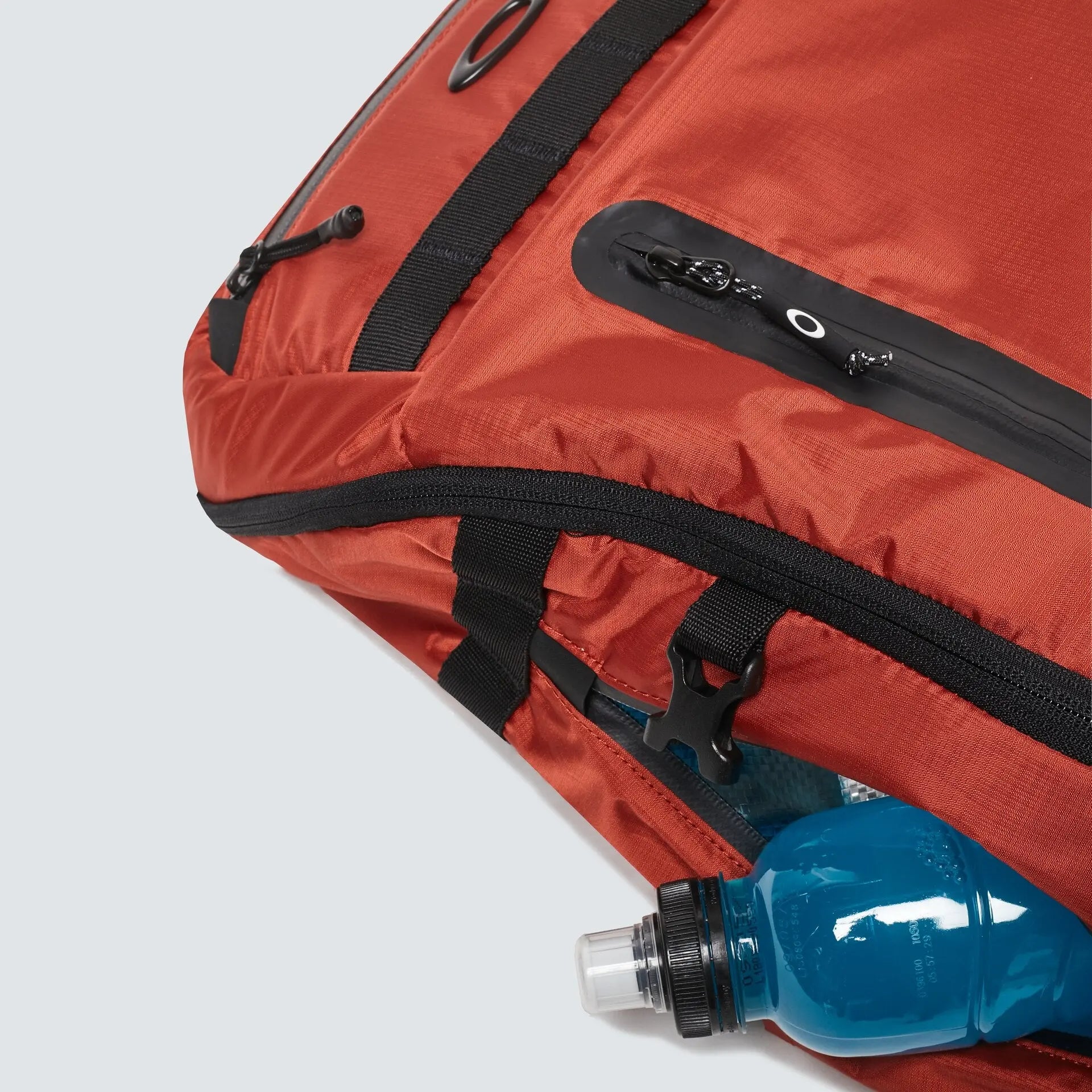 Oakley Outdoor Backpack in Brick - zipper and side pocket detail