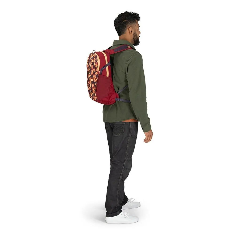Osprey Daylite 13L in Liquify Print/Kakio Pink, worn view (shared feature image)