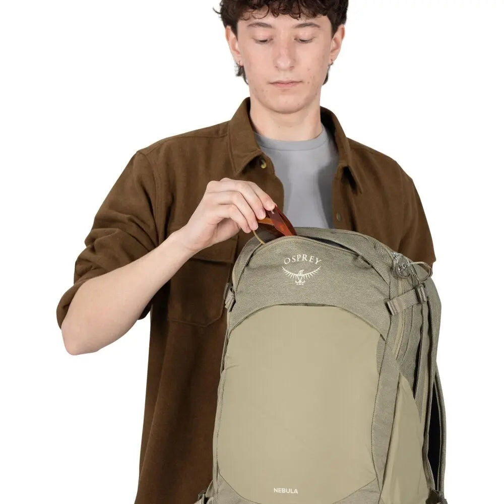 Osprey Nebula Driftshade scratch-resistant top pocket demonstrated in Olive Tan; shared feature