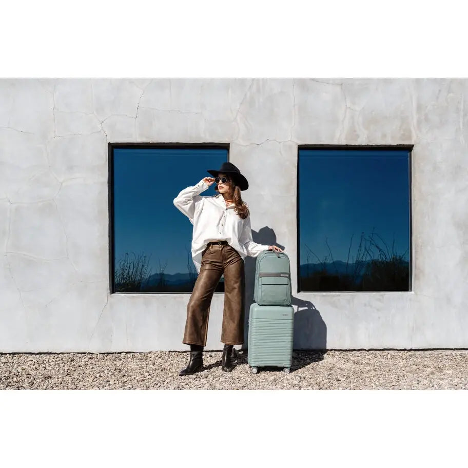 Samsonite Elevation Plus Cypress Green travel lifestyle; listing includes one Classic Carry-On only