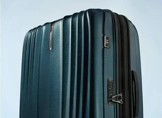 Samsonite Nexis expanded zipper gusset, combination lock and AB monogram tag