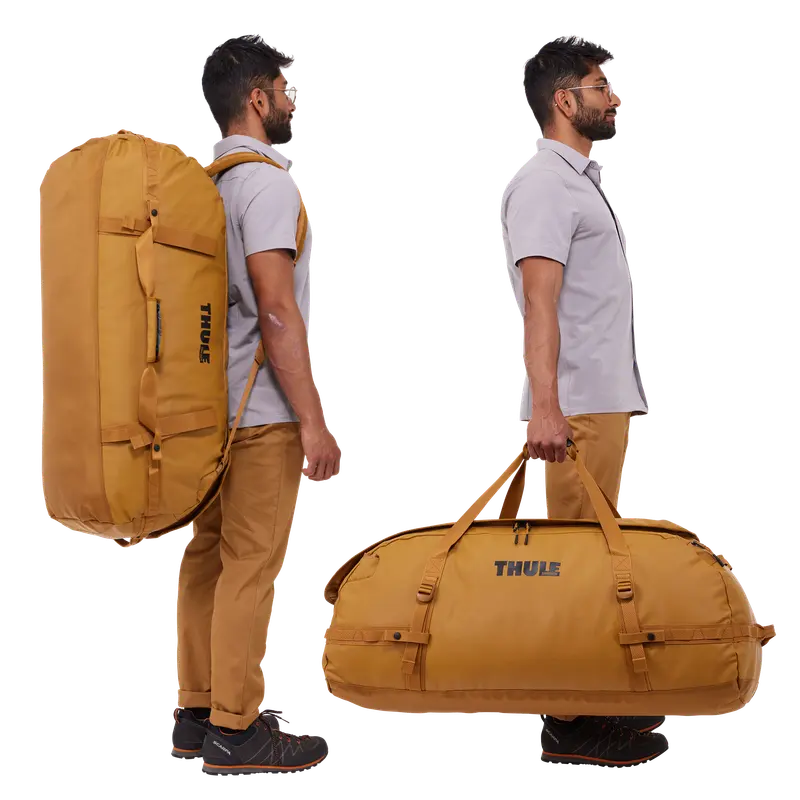 Thule Chasm 130L Golden Brown shown carried as a backpack and by its handles