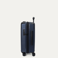 side profile view of the travelpro platinum elite compact carry-on hardside spinner in aviator navy, showcasing the slim design, integrated tsa lock, and the 2-inch expansion gusset.