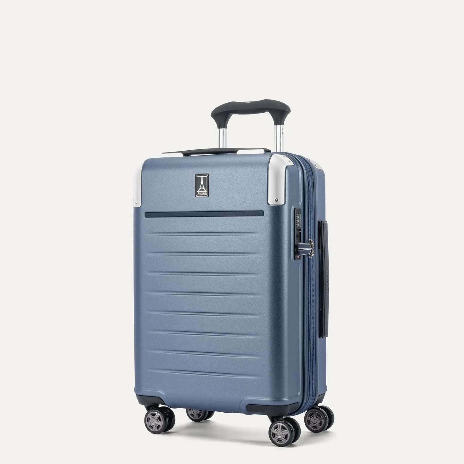 Front angled view of the Travelpro Platinum Elite Compact Carry-On Hardside Spinner in Dark Sky Blue, highlighting the sleek polycarbonate shell, polished aluminum corner armor, and integrated TSA lock.