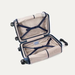interior view of the travelpro platinum elite compact carry-on hardside spinner in dark sky blue, showing the organized compartment with adjustable tie-down straps and the signature ecofab™ lining.