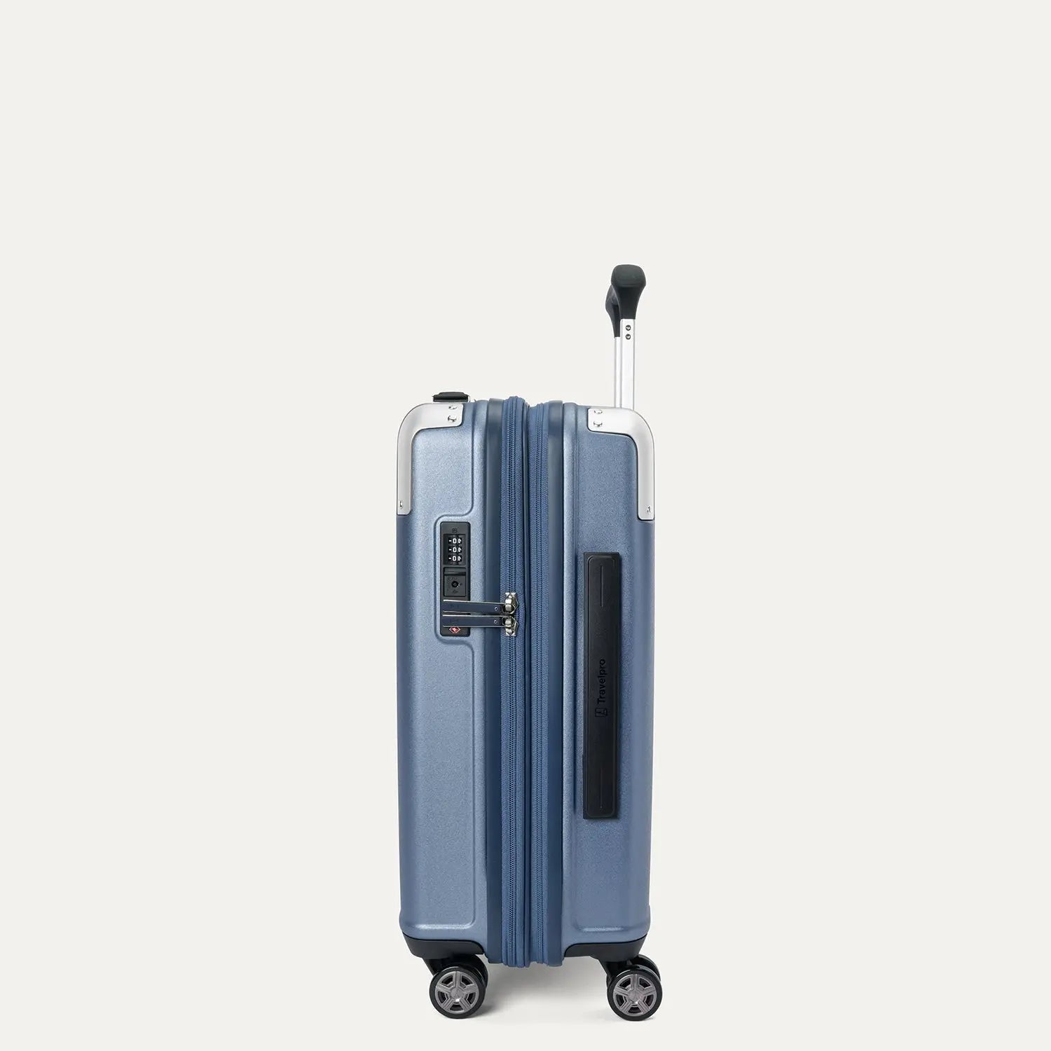 side profile view of the travelpro platinum elite compact carry-on hardside spinner in dark sky blue, showcasing the slim design, integrated tsa lock, and the 2-inch expansion gusset.