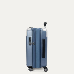 side profile view of the travelpro platinum elite compact carry-on hardside spinner in dark sky blue, showing the zippered expansion gusset that provides up to 2 inches of additional packing capacity.