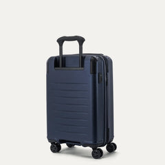 three-quarter rear view of the travelpro platinum elite compact carry-on hardside spinner in aviator navy, showcasing the sturdy powerscope lite telescoping handle and the high-performance spinner wheels.