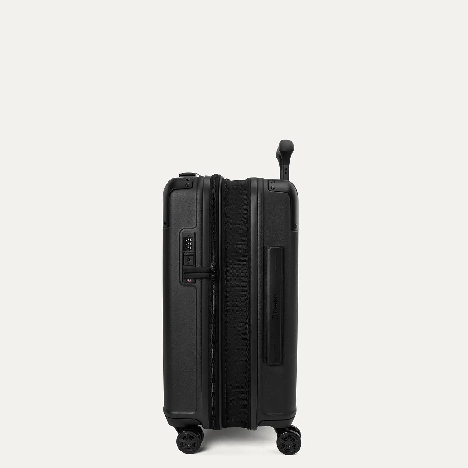 Side profile view of the Travelpro Platinum Elite Compact Carry-On Hardside Spinner in Aviator Navy, showing the zippered expansion gusset that provides up to 2 inches of additional packing capacity.