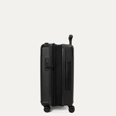 Side profile view of the Travelpro Platinum Elite Compact Carry-On Hardside Spinner in Aviator Navy, showing the zippered expansion gusset that provides up to 2 inches of additional packing capacity.