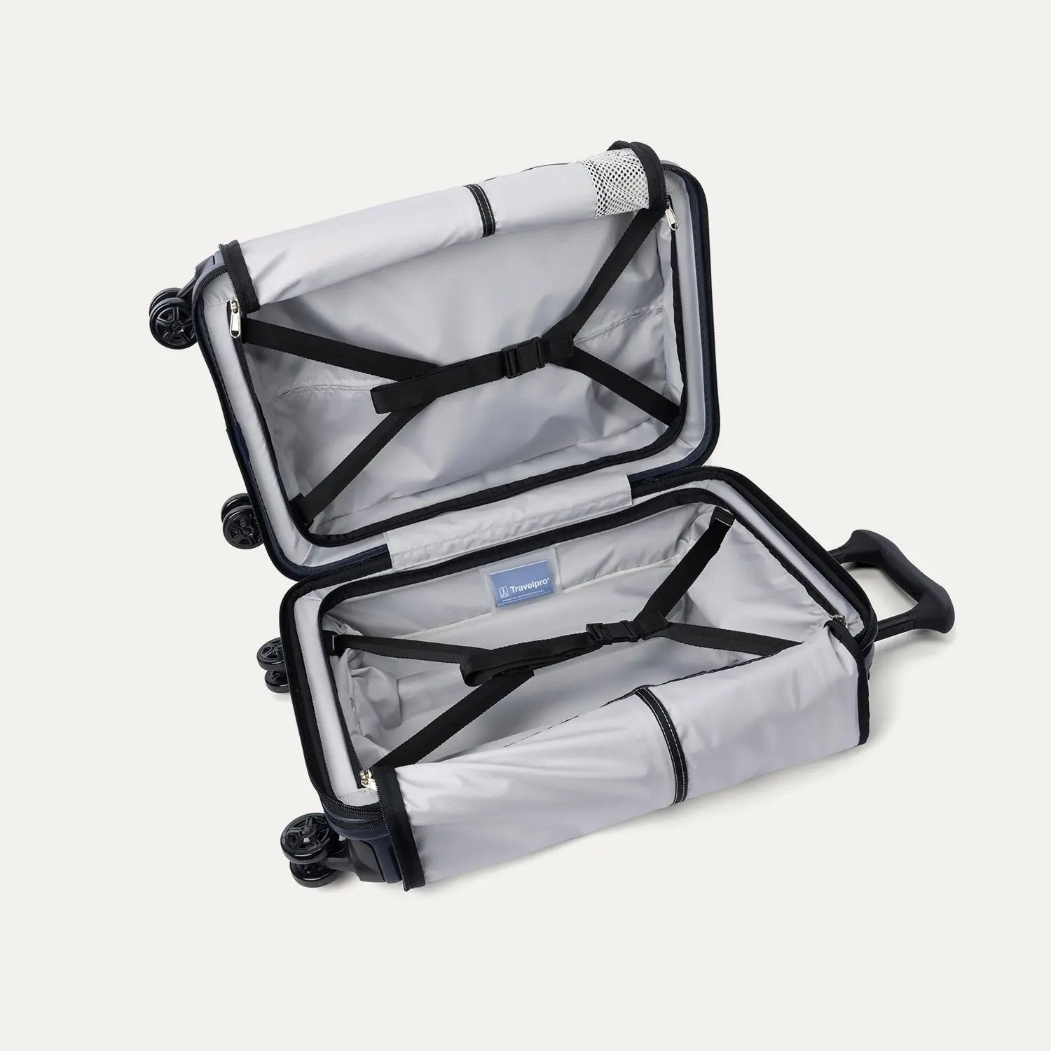 interior view of the open travelpro platinum elite compact carry-on hardside spinner in aviator navy, showing the organized compartment with adjustable hold-down straps and the signature ecofab™ lining.