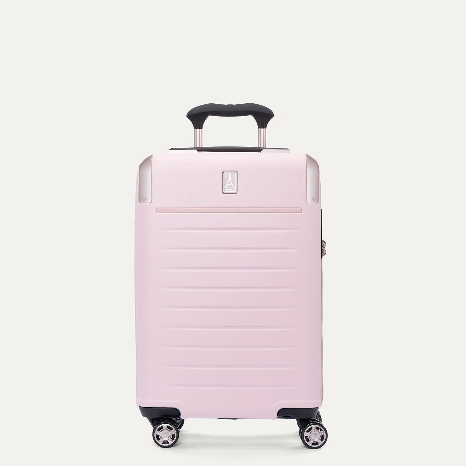 Front view of the light pink Travelpro Platinum Elite Next Gen Powder Pink Suitcase, showing the hardshell spinner with an extended black ProGrip telescoping handle, top carry handle, metallic corner guards, and multi-directional spinner wheels against a clean off-white background.