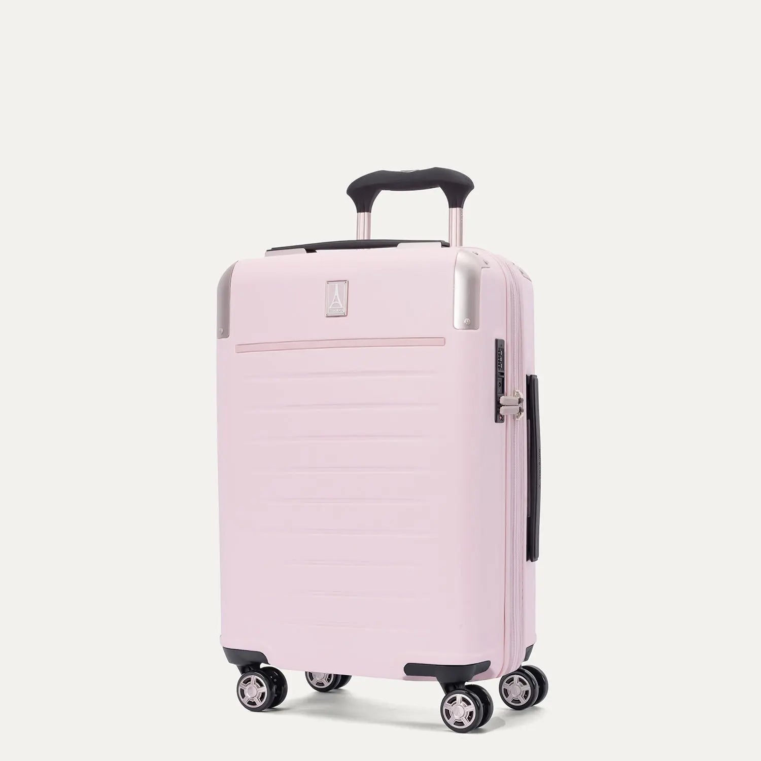 Front-three-quarters view of the light pink Travelpro Platinum Elite Next Gen Powder Pink Suitcase, showing the hardshell spinner with an extended telescopic handle, top carry handle, TSA-approved combination lock, and multi-directional spinner wheels against a clean off-white background.
