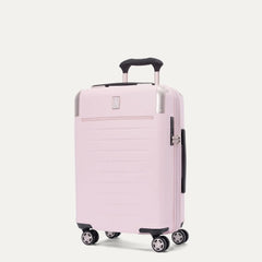 Front-three-quarters view of the light pink Travelpro Platinum Elite Next Gen Powder Pink Suitcase, showing the hardshell spinner with an extended telescopic handle, top carry handle, TSA-approved combination lock, and multi-directional spinner wheels against a clean off-white background.