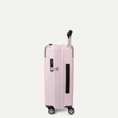 Side profile view of the light pink Travelpro Platinum Elite Next Gen Powder Pink Suitcase, featuring an extended telescopic handle, a black side handle grip, an integrated digital combination lock, and multi-directional spinner wheels against a solid off-white background.
