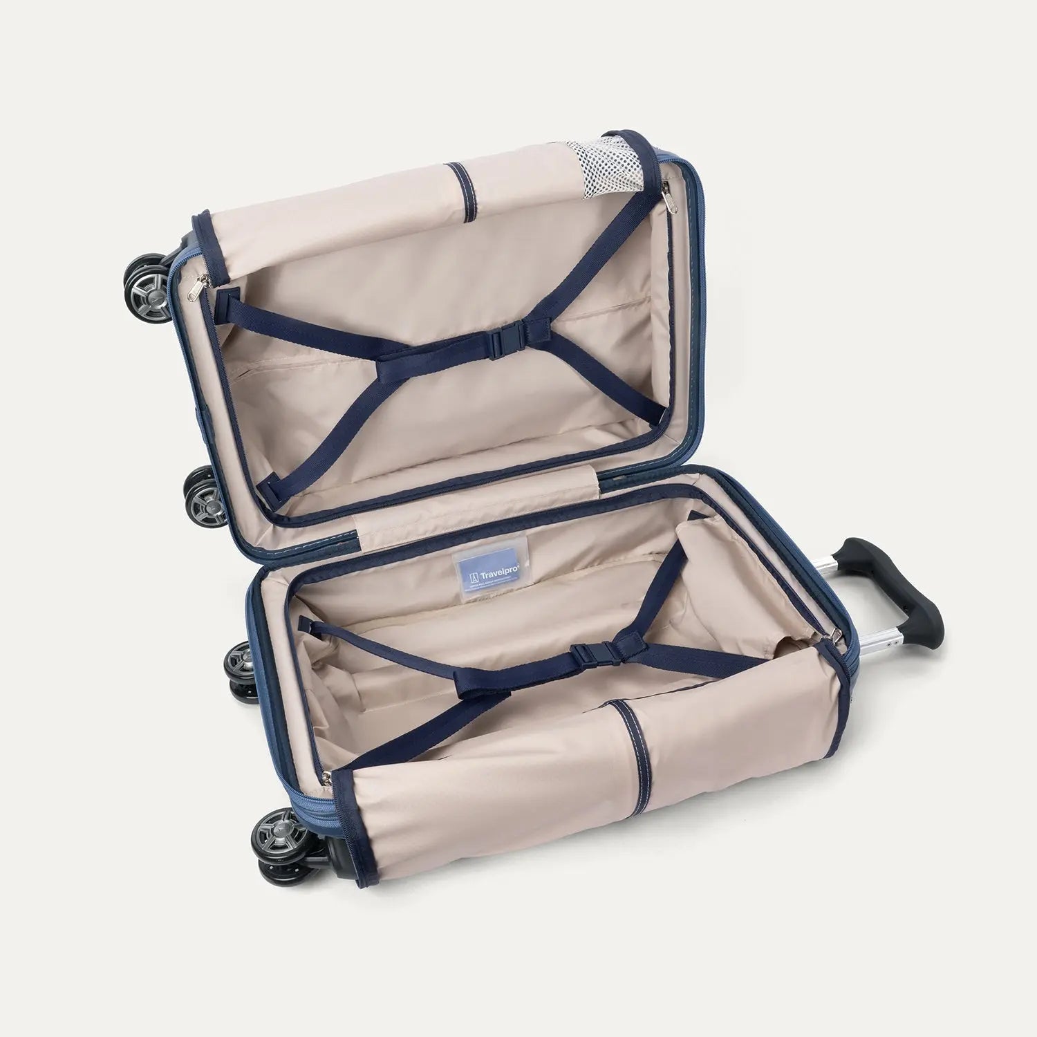 Fully open interior packing view of the Travelpro Platinum Elite Carry-On Hardside Spinner in Dark Sky Blue, showing the main compartment with adjustable hold-down straps and the sustainable ECOFAB™ lining.