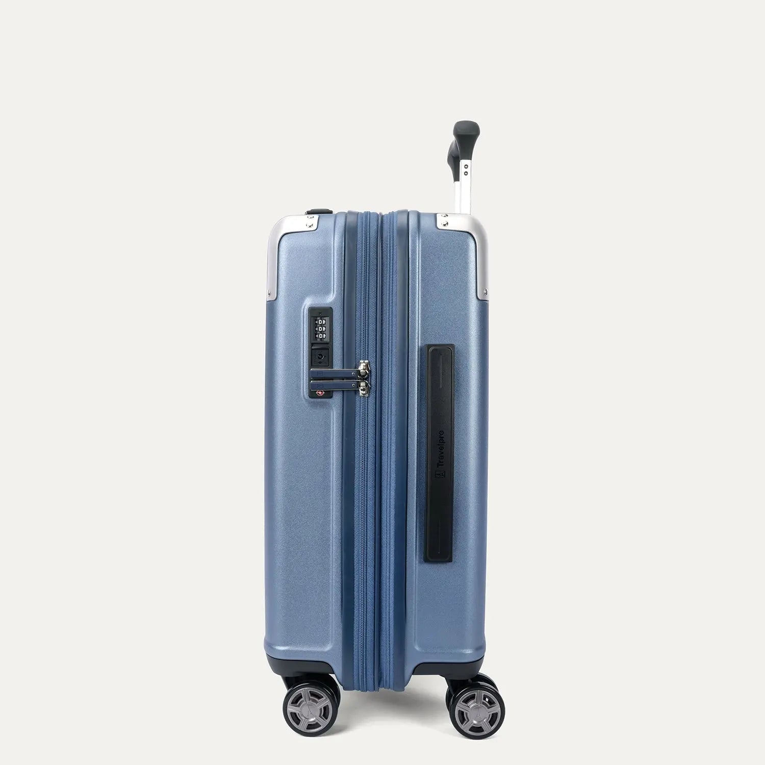 Side profile view of the Travelpro Platinum Elite Carry-On Hardside Spinner in Dark Sky Blue, showing the integrated TSA-approved lock, low-profile side carry handle, and the slim silhouette of the durable polycarbonate shell.