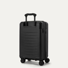 Rear angled view of the Travelpro Platinum Elite Carry-On Hardside Spinner in Jet Black, showing the durable polycarbonate shell, the PowerScope Lite telescoping handle, and the dual spinner wheels.