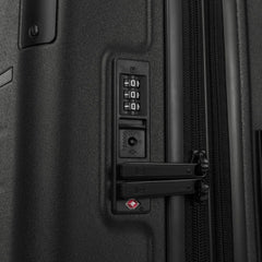 Close-up detail of the Travelpro Platinum Elite Carry-On Hardside Spinner in Jet Black, showing the integrated TSA-approved combination lock and secure zipper pulls on the durable polycarbonate shell.