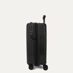 Side profile view of the Travelpro Platinum Elite Carry-On Hardside Spinner in Jet Black, showing the integrated TSA-approved lock, side carry handle, and the slim profile of the durable polycarbonate shell.
