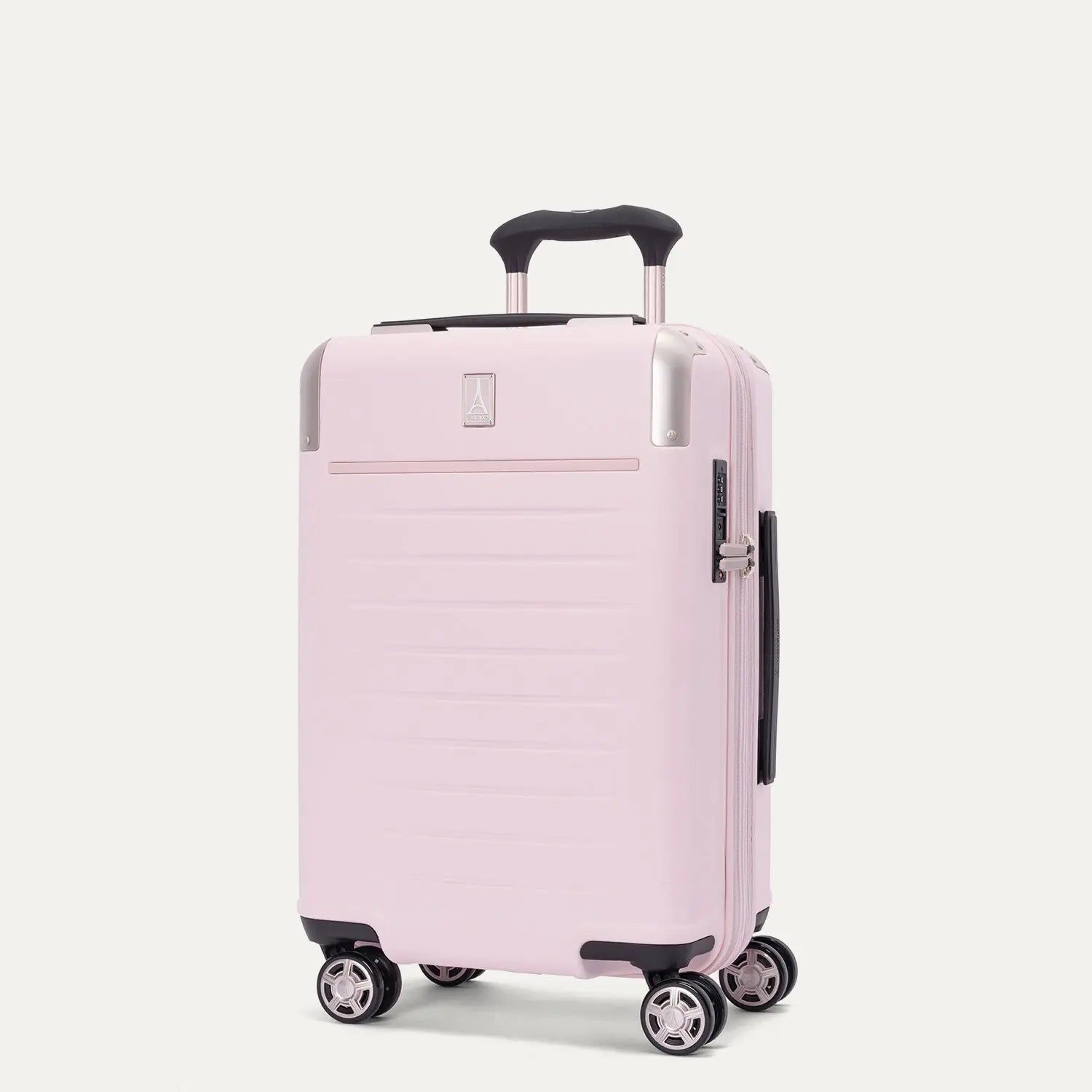 Front-three-quarters view of the light pink Travelpro Platinum Elite Next Gen Powder Pink Suitcase, showing the hardshell spinner with an extended telescoping handle, top carry handle, TSA-approved combination lock, and multi-directional spinner wheels against a clean off-white background.