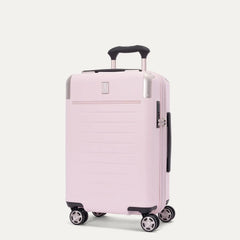 Front-three-quarters view of the light pink Travelpro Platinum Elite Next Gen Powder Pink Suitcase, showing the hardshell spinner with an extended telescoping handle, top carry handle, TSA-approved combination lock, and multi-directional spinner wheels against a clean off-white background.
