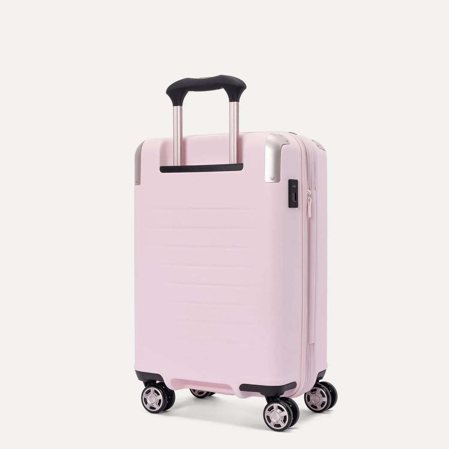 Rear-three-quarters view of the light pink Travelpro Platinum Elite Next Gen Powder Pink Suitcase, showing the hardshell spinner with an extended telescopic handle, top carry handle, TSA combination lock, and multi-directional spinner wheels against a clean off-white background.