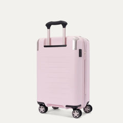 Rear-three-quarters view of the light pink Travelpro Platinum Elite Next Gen Powder Pink Suitcase, showing the hardshell spinner with an extended telescopic handle, top carry handle, TSA combination lock, and multi-directional spinner wheels against a clean off-white background.