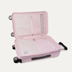Open interior view of the light pink Travelpro Platinum Elite Next Gen Powder Pink Suitcase, showing the main packing compartment with zippered dividers, mesh pockets, and multi-directional spinner wheels against a clean off-white background.