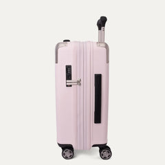 Side profile view of the light pink Travelpro Platinum Elite Next Gen Powder Pink Suitcase, showing the hardshell spinner with an extended telescopic handle, digital combination lock, vertical side handle grip, and multi-directional wheels against a clean off-white background.