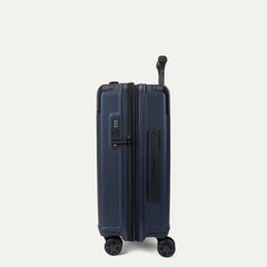 Side profile view of the Travelpro Platinum Elite Carry-On Hardside Spinner in Aviator Navy, showing the integrated TSA-approved lock, low-profile side carry handle, and the slim silhouette of the durable polycarbonate shell.