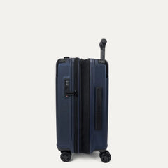 Side profile view of the Travelpro Platinum Elite Carry-On Hardside Spinner in Aviator Navy, showing the zippered expansion gusset that provides an additional 2 inches of packing capacity.