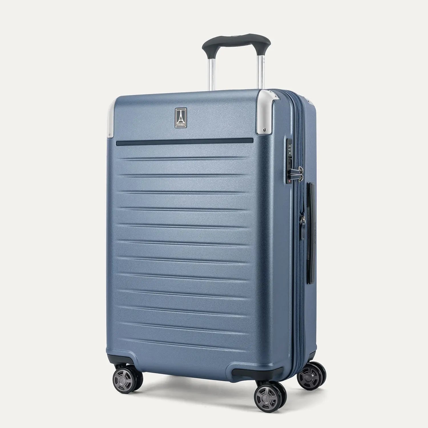 Three-quarter angled view of the Travelpro Platinum Elite Medium Check-In Hardside Spinner in Dark Sky Blue, showing the extended PowerScope Lite handle, integrated TSA lock, and dual spinner wheels.