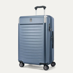 Three-quarter angled view of the Travelpro Platinum Elite Medium Check-In Hardside Spinner in Dark Sky Blue, showing the extended PowerScope Lite handle, integrated TSA lock, and dual spinner wheels.